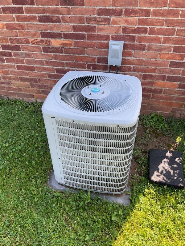 Completed comprehensive tune-up maintenance on residential HVAC system consisting of outdoor condensing unit and basement-located air handler. Performed standard preventive maintenance procedures including inspection of condenser coils, verification of electrical connections at disconnect box, and assessment of refrigerant lines. All components found operating within normal parameters with unit functioning properly at time of service.