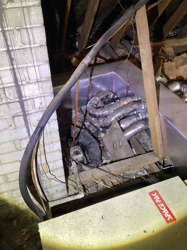 Provided comprehensive replacement estimate for 20+ year old attic-mounted air conditioning system with natural gas furnace. Inspected existing evaporator coil assembly showing significant dust accumulation and age-related wear, along with blue air handler unit and associated ductwork distribution system. Evaluated complete HVAC system configuration including serpentine coil design, insulated flex duct runs, and overall equipment placement within attic space to determine optimal replacement options for customer consideration.