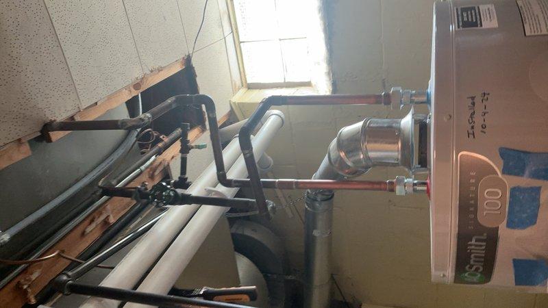Completed comprehensive Gold AC Inspection on residential split system with air handler located in basement and condensing unit positioned exterior. Performed thorough examination of indoor and outdoor components, verified electrical connections and capacitor integrity, inspected refrigerant lines and ductwork, and documented equipment condition through photographic records. System found operating within normal parameters with no immediate service concerns identified.