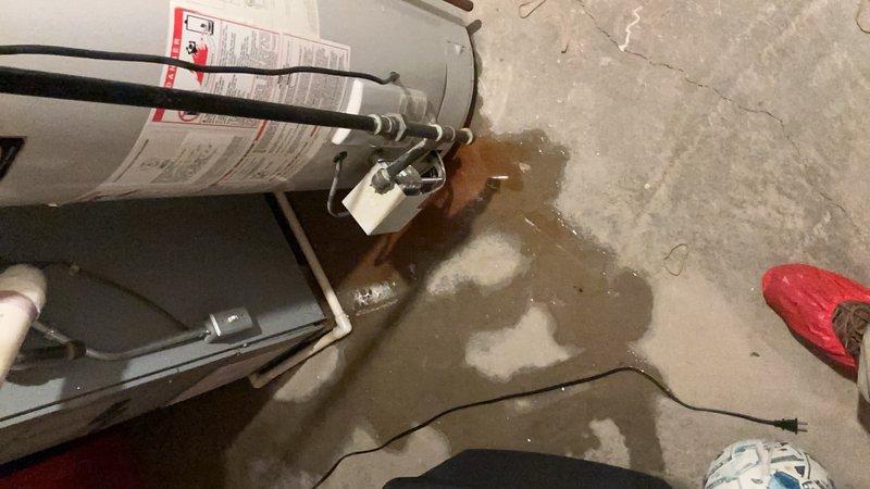 Responded to no hot water condition throughout residence caused by failed 15-year-old water heater with visible leaking at base. Removed and disposed of existing failed unit from basement location. Installed new 40-gallon power vent water heater with proper venting and gas connections. Reconnected water supply lines, installed new shut-off valves, and verified all connections for leaks. Tested unit operation, confirmed proper ignition sequence, and restored hot water service to entire home.