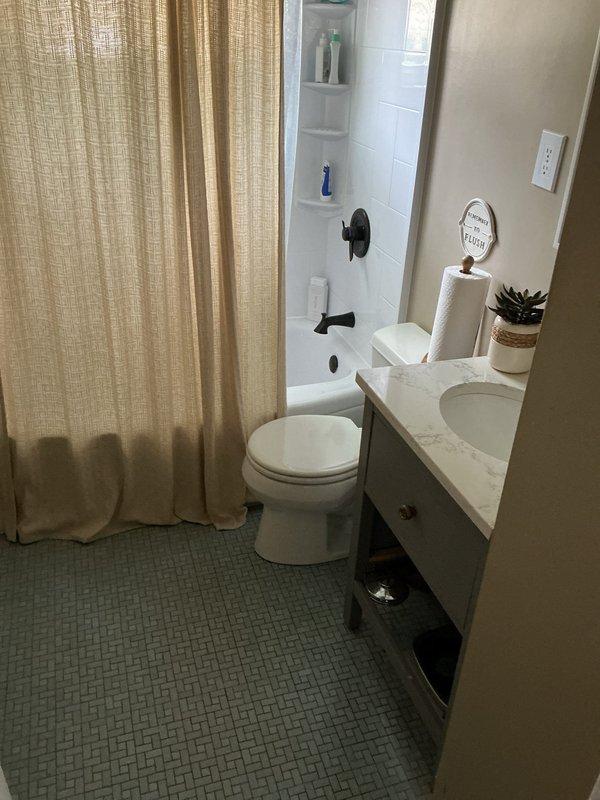 Responded to water leak originating from basement plumbing connected to toilet in 75-year-old residence. Located source of leak at pipe penetration point through floor joists where deteriorated sealing had failed. Repaired leak by securing pipe connection, applied expanding foam insulation around pipe penetration to seal gap and prevent future moisture infiltration, and verified proper drainage function to toilet fixture above. Confirmed no water damage to surrounding wooden framing and leak was successfully contained.