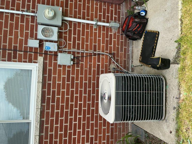 Completed comprehensive Gold AC Inspection on a 10+ year old single-unit air conditioning system with air handler located in basement. Performed thorough examination of outdoor condenser unit, refrigerant lines, electrical connections, and indoor mechanical components including pump assembly and copper piping configuration. System confirmed operational at time of inspection with all components functioning properly and documented with photographic evidence of equipment condition.