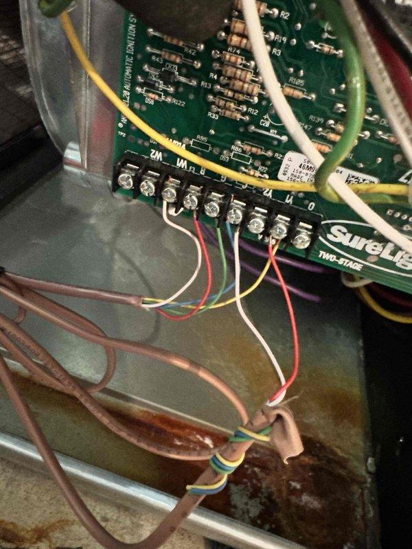 Resolved City of Troy mechanical code violations on residential HVAC system. Reconfigured condensate drain lines to comply with MMC2021 Section 307.2.5 and MRC2015 Section 1411.3.3, installing accessible cleanout points and red-capped service valves on white PVC drainage piping to allow blockage clearing and maintenance without cutting drain lines. Diagnosed and corrected air conditioning unit activating improperly in gas detection mode, addressing ASHRAE 15 and 15.2 compliance issues. Installed SUPCO control board with proper wiring connections to terminal strips, ensuring correct system operation and safety protocols. Secured all refrigerant lines with appropriate fasteners and verified system functionality upon completion.