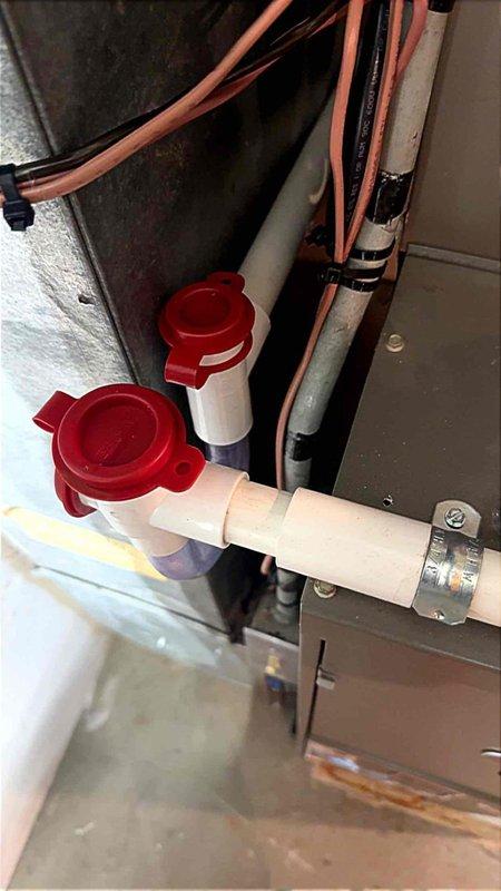 Resolved City of Troy mechanical code violations on residential HVAC system. Reconfigured condensate drain lines to comply with MMC2021 Section 307.2.5 and MRC2015 Section 1411.3.3, installing accessible cleanout points and red-capped service valves on white PVC drainage piping to allow blockage clearing and maintenance without cutting drain lines. Diagnosed and corrected air conditioning unit activating improperly in gas detection mode, addressing ASHRAE 15 and 15.2 compliance issues. Installed SUPCO control board with proper wiring connections to terminal strips, ensuring correct system operation and safety protocols. Secured all refrigerant lines with appropriate fasteners and verified system functionality upon completion.