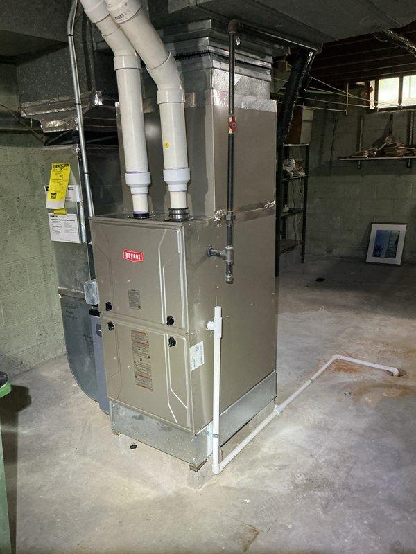 Completed Gold AC Inspection on 5-year-old residential air conditioning system with air handler located in basement. Performed comprehensive inspection of HVAC equipment including Bryant furnace unit with integrated humidifier system, verified operational status of all components, checked refrigerant levels, inspected ductwork and ventilation piping, examined electrical connections, and assessed overall system performance. All equipment found to be functioning properly with no deficiencies noted; unit maintained in good condition with proper installation of PVC exhaust venting and humidification system integration.