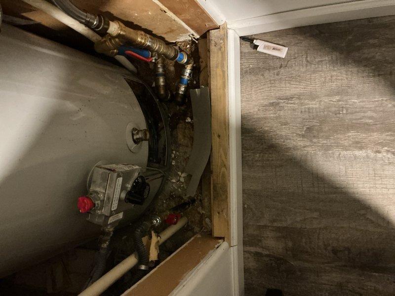 Responded to service call for tanked water heater with pilot light extinguishing when air conditioning system operates. Inspected water heater installation, gas supply connections, thermocouple assembly, and combustion air ventilation in utility closet. Evaluated potential backdrafting conditions and negative air pressure issues that could be caused by HVAC system operation affecting pilot flame stability. Assessed venting configuration, flue pipe connections, and clearances to identify any interference between water heater combustion requirements and air conditioning system operation.