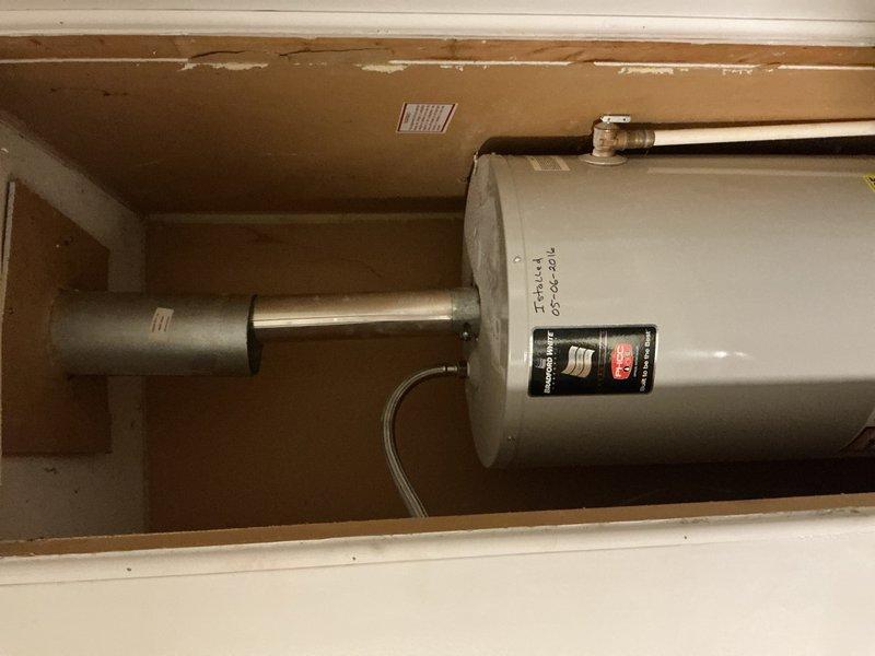 Responded to service call for tanked water heater with pilot light extinguishing when air conditioning system operates. Inspected water heater installation, gas supply connections, thermocouple assembly, and combustion air ventilation in utility closet. Evaluated potential backdrafting conditions and negative air pressure issues that could be caused by HVAC system operation affecting pilot flame stability. Assessed venting configuration, flue pipe connections, and clearances to identify any interference between water heater combustion requirements and air conditioning system operation.