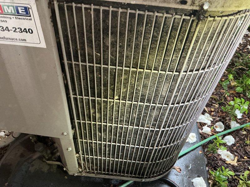 Responded to callback for AC unit not cooling below 72°F approximately 1-1.5 weeks after recent maintenance visit. Upon inspection, found outdoor condenser coil heavily contaminated with dirt, dust, debris, and organic growth including algae/mold accumulation on fins and grille surfaces, significantly restricting airflow and heat transfer capability. Measured supply air temperature at 48.6°F at ductwork, confirming refrigerant circuit operational but system operating at reduced capacity due to fouled condenser. Cleaned condenser coil thoroughly to restore proper airflow and heat rejection, verified system operation and cooling performance restored to manufacturer specifications.