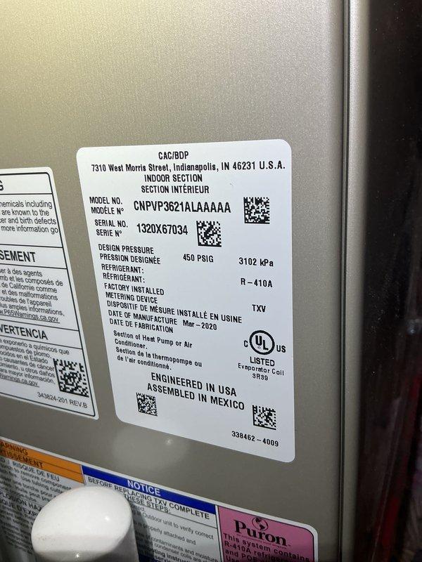 Completed comprehensive Gold AC Inspection on a 10-year-old Carrier air handler unit (Model: CNPVP3621ALAAAAA, Serial: 1320X67034) located in basement. System manufactured March 2020, utilizing R-410A refrigerant with design pressure rated at 450 PSIG. Performed thorough visual inspection of vertically stacked air handler assembly, examined all accessible components including blower compartment, evaporator coil section, and control panel. Verified electrical connections, inspected conduit and junction box mounting, assessed refrigerant line integrity and insulation condition. Documented equipment nameplate data and current operating specifications. Unit confirmed operational by homeowner prior to inspection. All accessible components inspected and photographed for maintenance records.