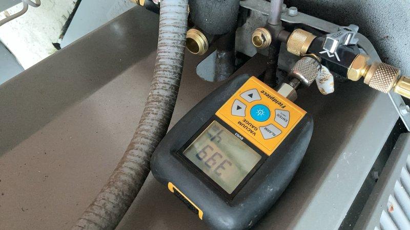 Responded to service call for air conditioning system requiring refrigerant recharge and leak repair. Upon arrival, located 10-year-old Lennox system with evaporator coil installed in basement mechanical room. Performed comprehensive leak search using electronic detection equipment and pressure testing methods on refrigerant lines and service connections. Connected manifold gauges to service ports to assess system pressures and confirm refrigerant loss. Inspected all accessible refrigerant lines, coil connections, and brass service valves for signs of leakage. Documentation photos captured equipment setup, gauge readings, and service port connections during diagnostic procedures. System evaluation completed to determine extent of refrigerant loss and identify leak source prior to repair recommendations.