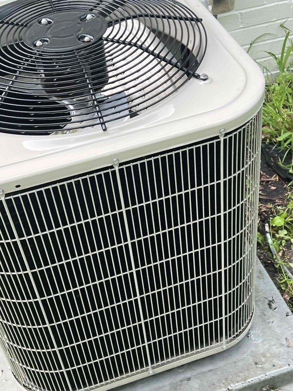 Completed comprehensive Gold AC inspection on 13-year-old residential air conditioning system with furnace-mounted air handler. Performed electrical diagnostics using digital multimeter, recording amperage draw of 95.00A and verifying proper system operation. Inspected outdoor condenser unit, confirming fan assembly, heat exchange coils, and cabinet components are in good working condition with no visible damage or deterioration.