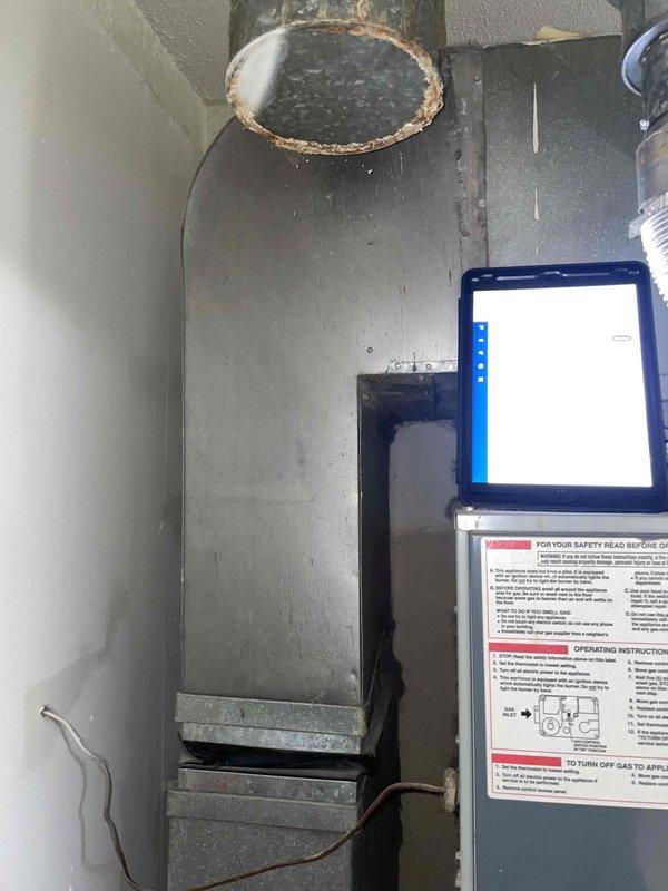 Completed comprehensive estimate for replacement of aging central air conditioning system utilizing obsolete R22 refrigerant. Existing evaporator coil exhibited freezing conditions, and system demonstrated inadequate cooling performance with thermostat set to 69°F while interior temperature remained at 75°F. Visual inspection revealed significant corrosion around ductwork connections and general wear on HVAC components, confirming need for complete system replacement rather than repair due to age and refrigerant phase-out considerations.