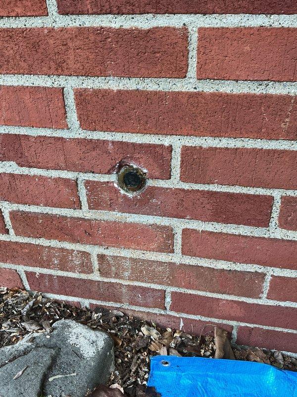 Responded to emergency call for broken copper water line where exterior pipe penetrates brick wall foundation and enters the building. Upon arrival, found interior wall already opened providing direct access to damaged section. Replaced compromised copper piping segment at wall penetration point, installed new fittings and connections, and pressure tested entire system to verify integrity. Confirmed all shut-off valves operational and no additional leaks present in surrounding plumbing assembly.