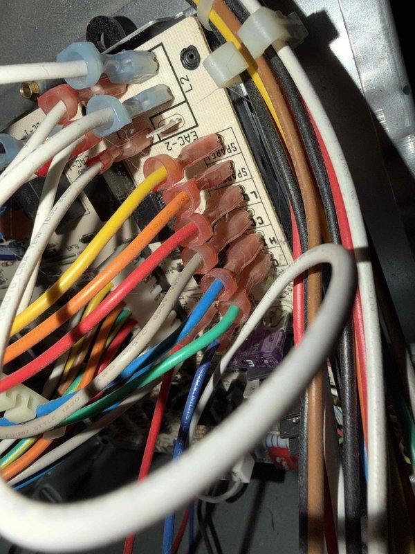 # HVAC Service Completed

Responded to service call for central air conditioning system not cooling while heating function remained operational. Upon arrival, performed thorough inspection of outdoor condenser unit and found excessive dirt accumulation affecting system performance. 

Cleaned condenser coil fins and removed debris from unit exterior and surrounding area. Inspected electrical connections at terminal block and verified all wire connections were secure. Tested system operation after cleaning and confirmed proper cooling function restored. Unit returned to normal operating condition with adequate airflow through condenser fan assembly.