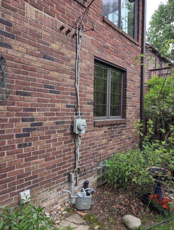 Responded to customer report of circuit issues and flickering lights in front room. Inspected main electrical panel and verified proper breaker operation, connections, and circuit integrity. Examined exterior electrical service equipment including meter base and conduit installation to ensure proper grounding and service delivery. All circuits tested and confirmed operational with no loose connections or overloaded breakers identified.