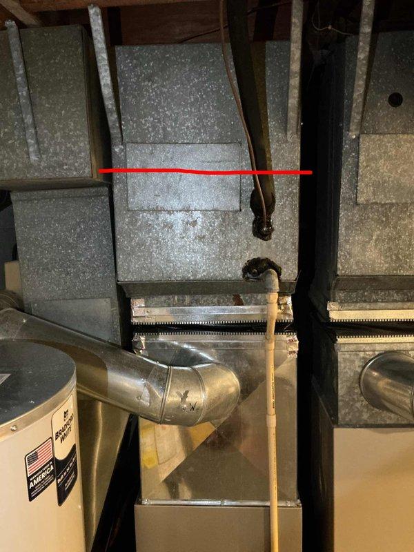 Responded to service call for dual-zone HVAC system with second floor air conditioning not cooling and furnace water leakage. Found both air conditioning systems dating from 2001 located in basement. Second floor AC unit critically low on R22 refrigerant, identified as priority replacement. Main floor AC diagnosed with failed capacitor. Due to age of equipment, obsolete R22 refrigerant, and multiple system failures, provided comprehensive replacement estimates for both AC units and furnace/AC combinations as requested.