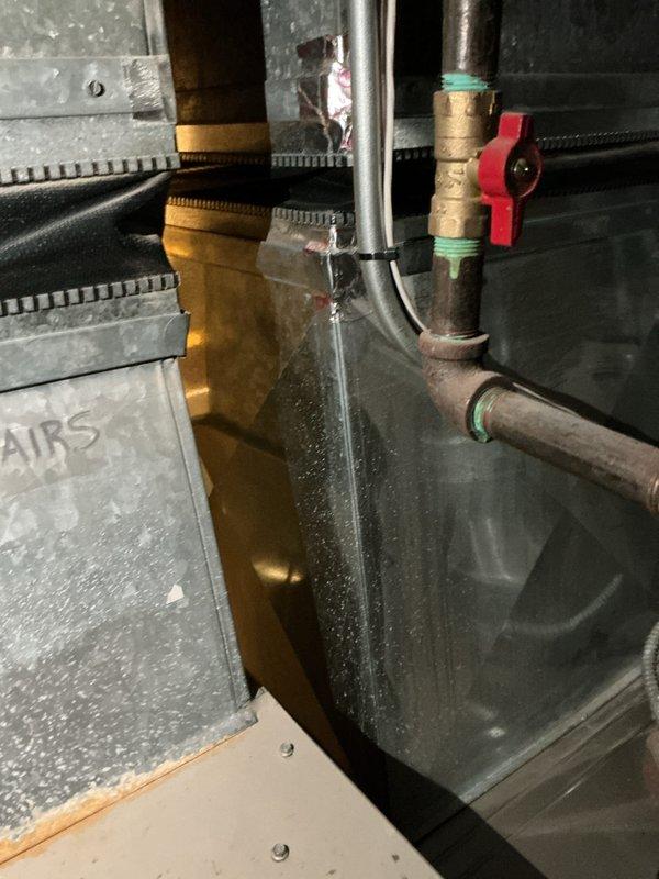 Responded to service call for dual-zone HVAC system with second floor air conditioning not cooling and furnace water leakage. Found both air conditioning systems dating from 2001 located in basement. Second floor AC unit critically low on R22 refrigerant, identified as priority replacement. Main floor AC diagnosed with failed capacitor. Due to age of equipment, obsolete R22 refrigerant, and multiple system failures, provided comprehensive replacement estimates for both AC units and furnace/AC combinations as requested.