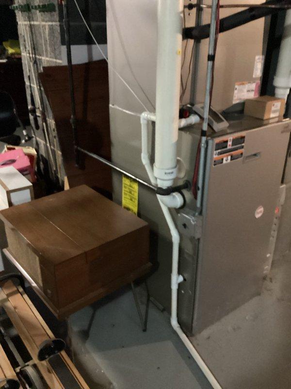 Conducted comprehensive assessment of 16-year-old Payne furnace system and 11-year-old air conditioning unit that was running but failing to provide adequate cooling. Evaluated both heating and cooling equipment for replacement options, documented current system conditions including outdoor condenser unit performance, and photographed existing basement furnace installation and mechanical room layout to provide accurate replacement estimate for aging HVAC system nearing end of serviceable life.