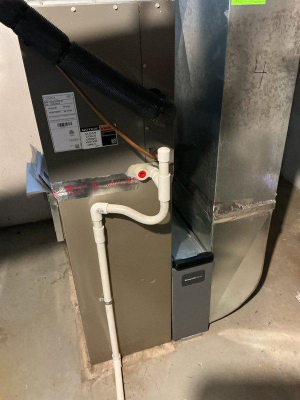 Returned to property to complete Gold AC Inspection on 2023 HVAC system with air handler located in basement and dual outdoor condenser units. Performed comprehensive inspection of all components including furnace, plenum assembly, condensate drain system with PVC piping, and both outdoor condensing units positioned on concrete pads against brick exterior. 30 amp disconnect installation and any necessary diagnostic work to be completed upon receipt of disconnect from shop.