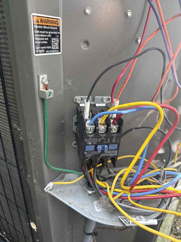Responded to callback for air conditioning system that was previously serviced but stopped operating again. Upon inspection of the outdoor condensing unit's electrical panel, diagnosed failed three-phase contactor. Documented existing wiring configuration and electrical connections for replacement. Ordered replacement contactor and scheduled follow-up visit to complete repair and restore system operation.