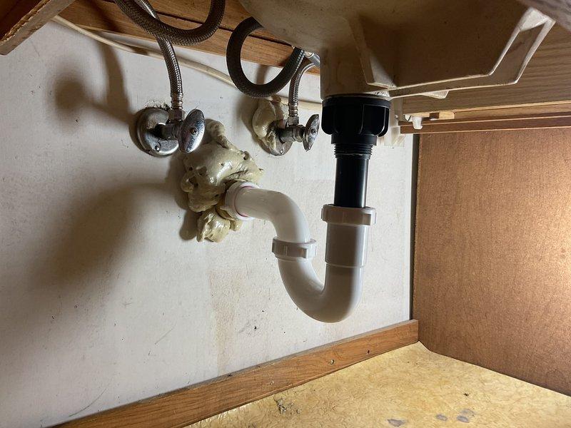 Completed installation of a new three-piece widespread bathroom faucet in brushed gold/bronze finish with matching drain assembly. Also installed an exterior hose bib with proper shutoff valve. All supply lines were connected with braided stainless steel hoses, P-trap was properly assembled with compression fittings, and all connections were tested for leaks to ensure proper operation.
