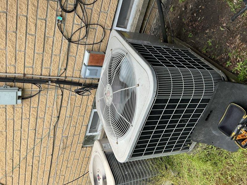 Completed preventive maintenance service on two 15-year-old air conditioning units for Blue Plan membership customer preparing for summer season. Both systems were operating normally with no reported issues. Performed comprehensive inspection and routine maintenance on downstairs unit and attic-mounted unit, navigating tight attic access space to service equipment. Inspected outdoor condenser units, verified proper operation of cooling systems, checked refrigerant levels, cleaned components as needed, and confirmed all electrical connections were secure. Both AC units and furnace system tested and found to be heating and cooling properly upon completion of scheduled maintenance visit.