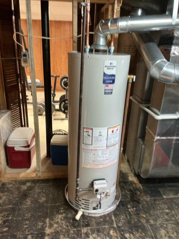 Installed a new 40-gallon tanked water heater in the basement utility room, replacing the existing unit. Connected all supply and discharge plumbing lines, installed pressure relief valve with proper discharge piping, and verified all connections were secure and leak-free. Reconnected gas supply line to the unit, tested for proper ignition and burner operation, and confirmed the water heater was functioning according to manufacturer specifications.