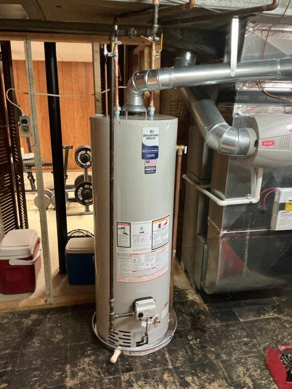 Installed a new 40-gallon tanked water heater in the basement utility room, replacing the existing unit. Connected all supply and discharge plumbing lines, installed pressure relief valve with proper discharge piping, and verified all connections were secure and leak-free. Reconnected gas supply line to the unit, tested for proper ignition and burner operation, and confirmed the water heater was functioning according to manufacturer specifications.