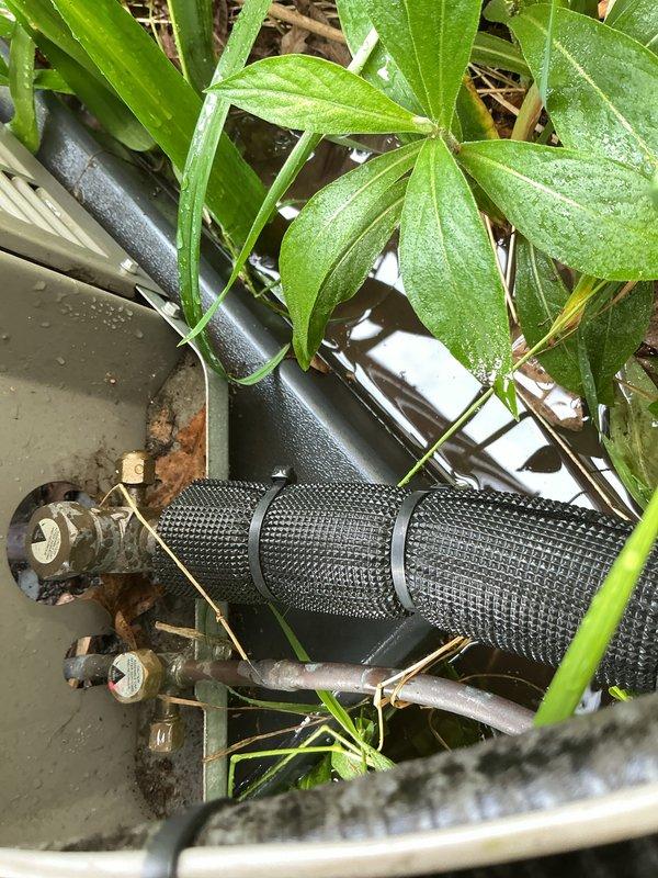 Completed comprehensive Gold AC Inspection on 6-year-old residential air conditioning system with air handler located in basement. Performed full system evaluation including visual inspection of outdoor condensing unit, refrigerant lines, electrical disconnect, and filter components. Advised customer that condenser area requires clearing of surrounding debris and vegetation encroachment to maintain proper airflow and system efficiency. All major components operational at time of inspection, with system responding normally to thermostat commands and maintaining proper cooling cycle.