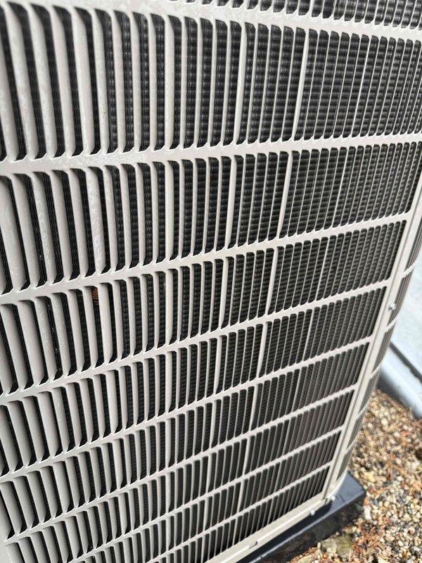 Completed comprehensive tune-up and inspection on 10-year-old HVAC system located in basement, including CO2 level assessment as requested. Performed visual inspection of outdoor condenser unit, noting accumulated debris between fins and heat exchanger slats requiring attention. Utilized borescope camera to conduct internal inspection of evaporator coil assembly, documenting condition of fins and heat exchanger components for maintenance records.