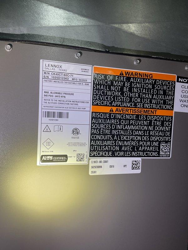 Completed Gold AC inspection on 10-month-old Lennox system (Model CK40C1-60C-71) with outdoor condensing unit and basement air handler. Verified system operational status, inspected all accessible components including ductwork, checked manufacturer labels and safety warnings for compliance, and documented equipment condition through photographs. All equipment found operating normally with no immediate service needs identified.