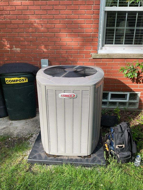 Completed Gold AC inspection on 10-month-old Lennox system (Model CK40C1-60C-71) with outdoor condensing unit and basement air handler. Verified system operational status, inspected all accessible components including ductwork, checked manufacturer labels and safety warnings for compliance, and documented equipment condition through photographs. All equipment found operating normally with no immediate service needs identified.