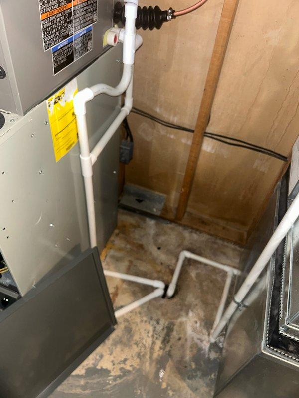 Completed installation of 4-ton air conditioning system with matching evaporator coil on first floor. Installed new A-coil assembly above existing furnace, connected refrigerant lines, and established proper drainage with PVC condensate piping. Performed electrical reconnections, tested system operation, and verified proper airflow through ductwork connections. Mechanical and electrical permits requested for installation compliance.