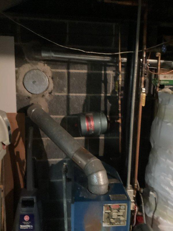 Responded to service call for boiler system with overheating motor. Conducted thorough inspection of blue boiler unit and associated components in basement mechanical room, including examination of circulator pump motor, piping connections, copper supply lines, and PVC venting system. Documented equipment condition with photographs showing complete installation setup, pipe configuration, and mechanical components for estimate preparation, as unit requires quotation for necessary repairs or replacement.