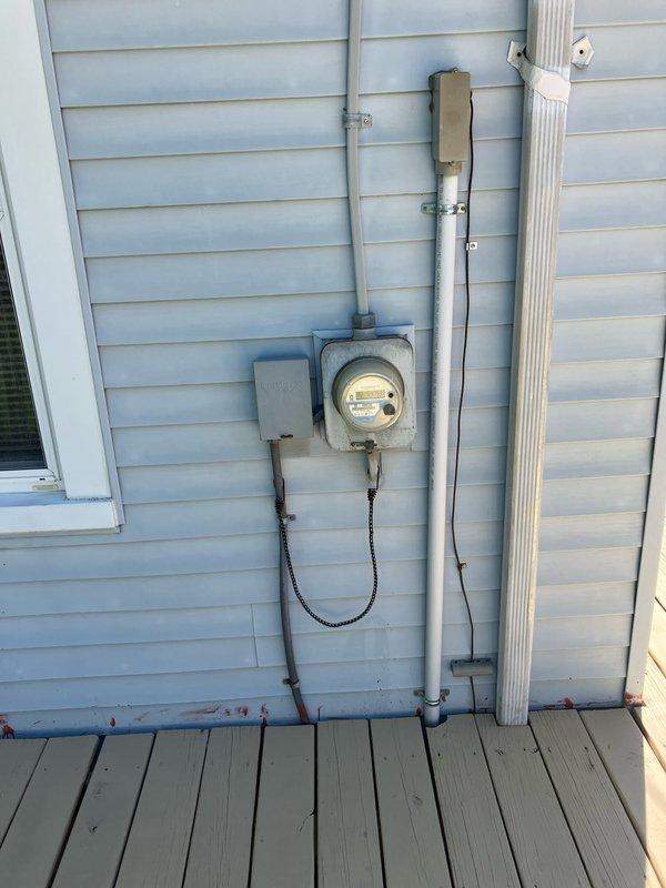 Conducted on-site assessment for complete air conditioning system replacement at small residential property under 1500 square feet. Evaluated existing cooling unit location, electrical service capacity at meter panel, and exterior mounting area along foundation. Documented current system configuration including conduit routing and power supply connections to provide accurate replacement specifications and equipment recommendations.