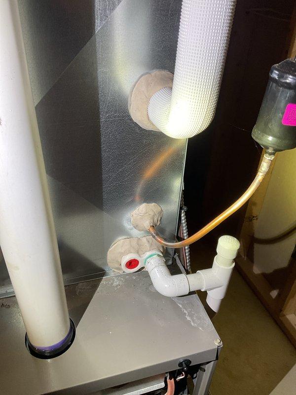 Completed comprehensive Gold AC Inspection on a 3-year-old residential HVAC system. Inspected basement-mounted air handler unit with copper refrigerant lines and PVC condensate drainage, confirming proper insulation and secure connections. Evaluated outdoor condenser unit positioned on concrete pad, verifying operational fan assembly, louvered panel ventilation, and overall system functionality. All equipment found in proper working condition with no deficiencies noted.