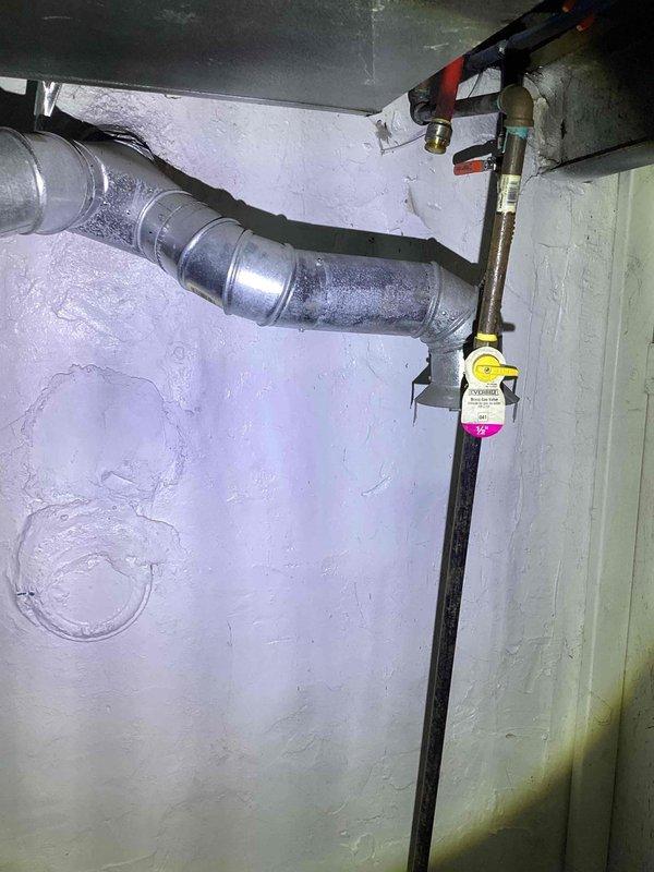 Provided estimate for replacement of non-functional 30-gallon electric water heater located in basement. Unit age unknown; existing installation shows signs of moisture exposure in surrounding area with visible water staining on walls and condensation present on nearby ductwork, indicating potential previous leakage or humidity issues that should be addressed during replacement.