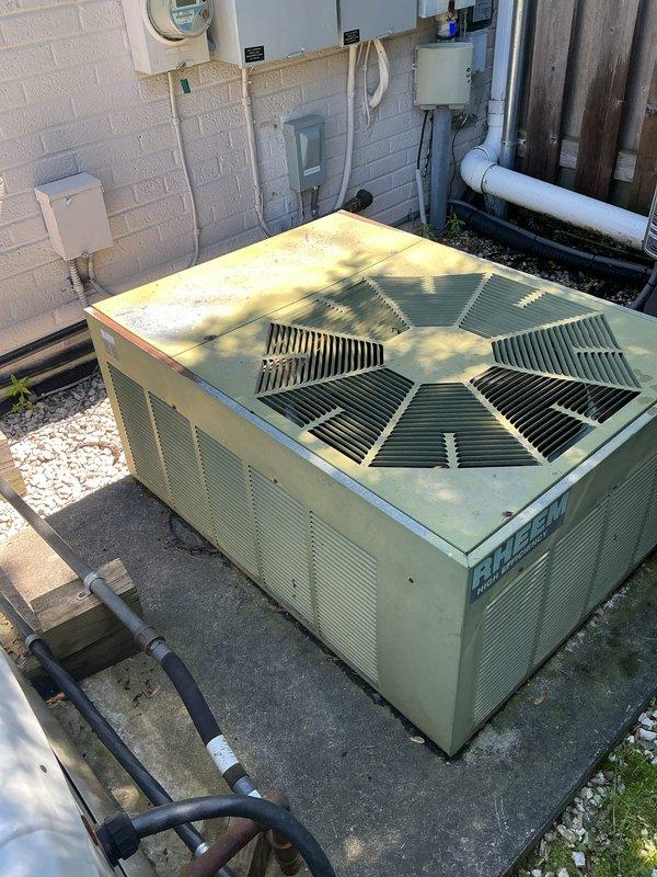 Completed comprehensive Gold AC inspection on 2024-installed residential air conditioning system. Performed thorough examination of outdoor condensing unit, verified proper operation of condenser fan, inspected refrigerant line connections and electrical components including disconnect box, and confirmed unit is mounted securely on concrete pad with proper drainage. All components found to be functioning within normal parameters with appropriate seasonal weathering for outdoor installation.