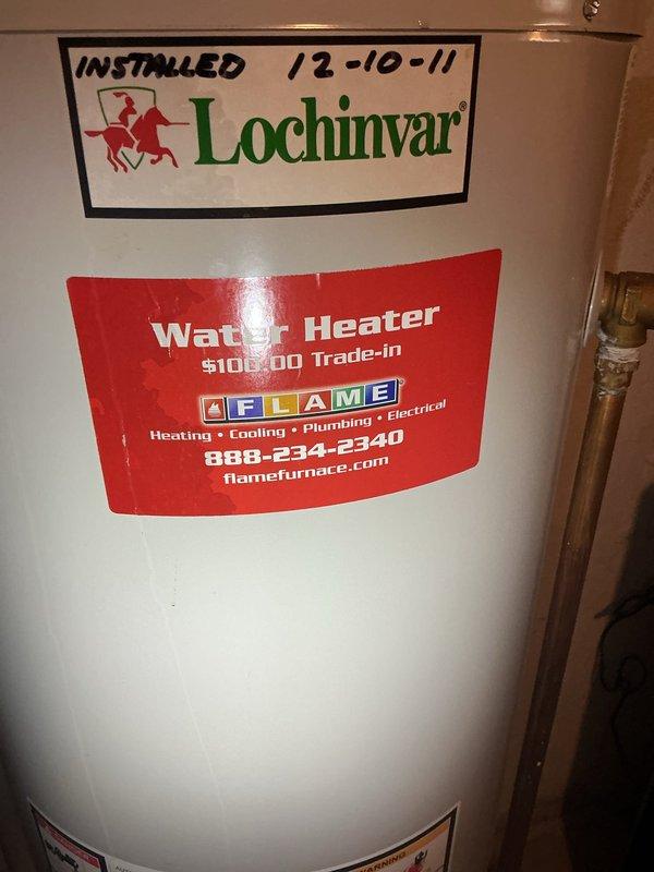 Replaced failed 50-gallon residential tanked water heater that was experiencing catastrophic leakage from the bottom of the tank. Removed and properly disposed of the original Lochinvar unit that had been in service since 2011. Installed new 50-gallon tanked water heater with proper connections to existing copper supply lines and drain piping. Verified all connections for leaks, tested temperature and pressure relief valve operation, and ensured proper venting and combustion air supply. Unit commissioned and left in full operational status.