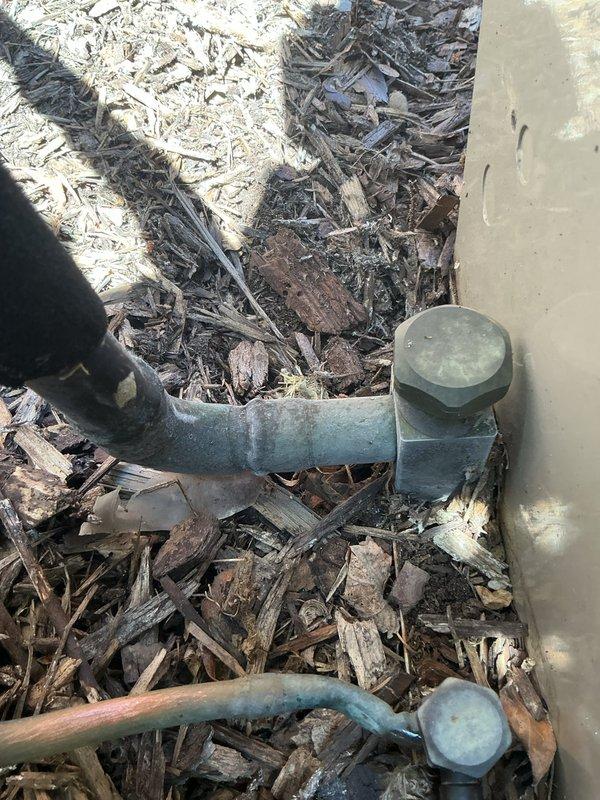 Responded to water leak complaint on 6-year-old air conditioning system located in basement. Upon inspection, unit was operational and maintaining cooling capacity. Examined indoor evaporator coil assembly and condensate drainage system for source of water leak. Inspected outdoor condenser unit components including compressor, refrigerant lines, and electrical connections. Checked condensate drain line routing from basement unit to exterior discharge point. Verified proper drainage flow and cleared any blockages in condensate system. Inspected refrigerant line insulation for condensation issues. All refrigerant connections showed normal operating condition with no signs of refrigerant leakage. System tested and confirmed operational with proper cooling performance restored.