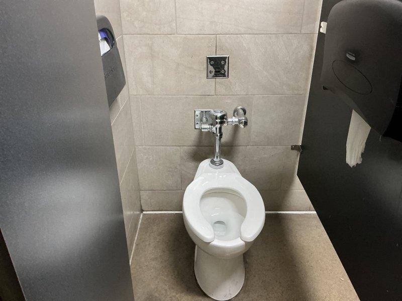 Responded to commercial facility for reported dripping faucet issues in men's restroom adjacent to room 103. Upon arrival, inspected plumbing fixtures in multiple restroom stalls including standard and ADA-accessible facilities. Examined chrome flush valves, exposed piping connections, and wall-mounted fixtures for leaks or malfunction. Addressed dripping conditions at affected faucet locations, performed necessary repairs to restore proper operation and eliminate water waste. All fixtures tested and verified operational upon completion.