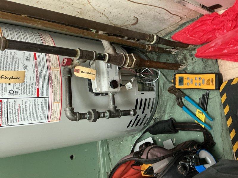 Responded to callback for gas water heater experiencing repeated thermal limit switch trips and loss of hot water. Removed burner assembly and thoroughly cleaned intake system to eliminate blockage causing improper combustion and overheating conditions. Inspected blower wheel and housing, verified proper airflow, and tested all safety controls for correct operation before returning unit to service.