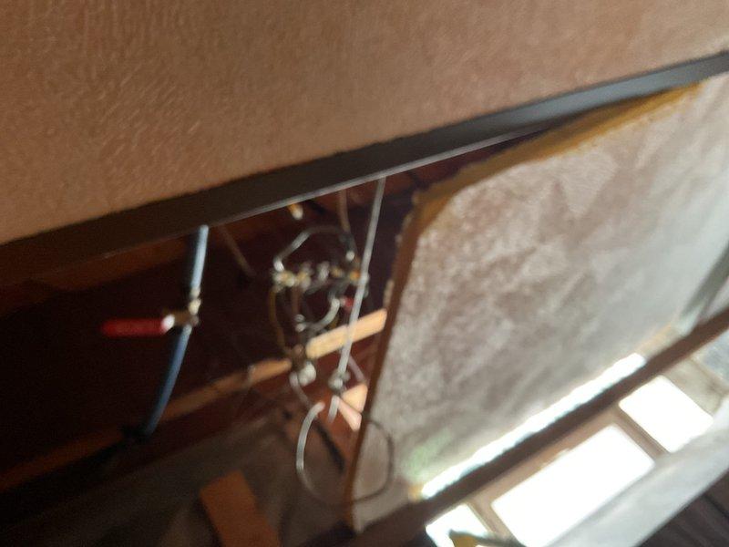 Responded to service call for Lochinvar water heater failing to ignite after three attempted starts. Inspected unit installed in basement utility area and verified all gas supply connections, venting system, and electrical components. Examined exhaust piping and flue configuration for proper operation. Additionally investigated reported water leak as flagged by water department. Conducted visual inspection of accessible plumbing throughout basement area, checking supply lines, drain connections, and fixtures for signs of moisture or active leaks. Photographed water heater installation and surrounding plumbing infrastructure for documentation purposes. Assessed copper and brass pipe fittings at water heater connections for potential leak sources.