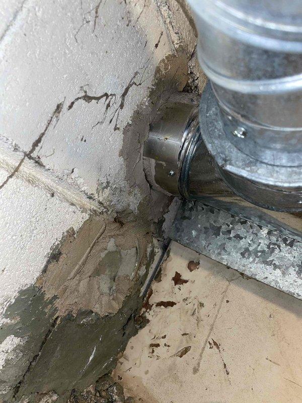 Conducted comprehensive site assessment for full HVAC system replacement including central air conditioning and furnace. Inspected existing ductwork infrastructure in basement utility area, noting galvanized metal supply ducts with cylindrical connection joints and mounting hardware. Documented current installation conditions including foundation wall integrity, floor conditions, and existing duct routing for proper equipment sizing and placement planning. Photographed installation area to capture structural considerations and clearance requirements for new equipment placement. Provided detailed quote for complete system replacement.