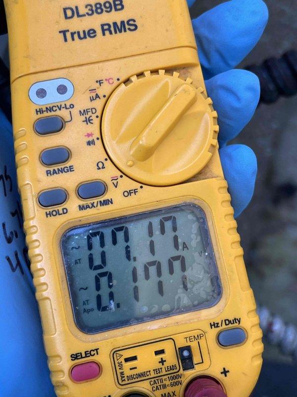 # HVAC Service Completed

Responded to service call for 11-year-old ICP air conditioning system experiencing inadequate cooling. Customer reported unit running continuously but failing to reach set temperature, suspecting low refrigerant charge.

Upon arrival, performed comprehensive AC tune-up and diagnostic evaluation. Conducted electrical measurements using digital multimeter to verify proper amperage draw on compressor and system components. Measured current readings showing 61.08 and 61.45 amps, indicating compressor operation within expected parameters for the unit size.

Inspected refrigerant system for potential leaks or charge issues as reported by customer. Evaluated system performance including temperature differential across evaporator coil, suction and discharge pressures, and overall cooling capacity. Checked airflow across indoor coil and verified proper air handler operation.

Performed standard tune-up procedures including cleaning condenser coil, checking electrical c