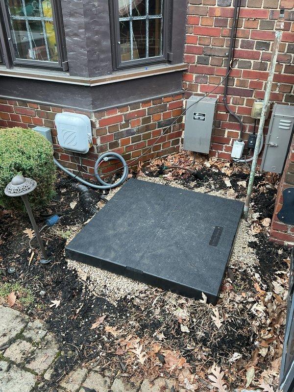 Completed full HVAC system installation including new furnace and air conditioning unit with outdoor condenser pad. Installed gray cabinet-style furnace in basement utility area with PVC venting and connected ductwork, positioned AC condenser on concrete pad in exterior side yard with proper electrical connections and refrigerant lines. Coordinated electrical work, obtained necessary permits, and submitted documentation for utility rebate program.