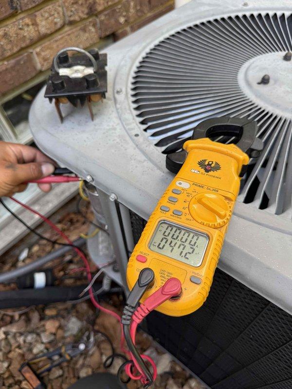 Responded to no cooling call on 15-year-old air conditioning system with condensing unit located in basement coil area. Upon arrival, confirmed unit would not power on. Performed diagnostic testing using digital multimeter on outdoor condensing unit to measure voltage and electrical continuity across key components. Testing focused on capacitor, contactor, and associated wiring connections to identify failure point preventing system operation. Based on equipment age and observed conditions during testing, provided homeowner with repair options and recommendations for restoring cooling functionality.