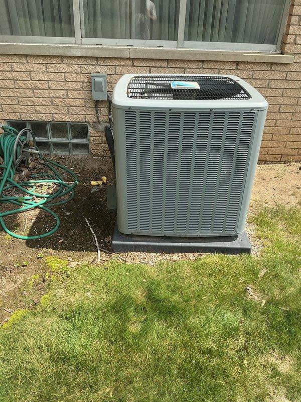 Completed comprehensive Gold AC inspection on 7-year-old residential air conditioning system. Performed full system evaluation of outdoor condenser unit and basement-located air handler, including visual inspection of all accessible components, electrical connections, and refrigerant lines. Unit confirmed operational at time of service. Documented equipment condition with photographs showing exterior condenser positioned on concrete pad with proper clearances and indoor components in basement utility area. All major system components inspected and found functional with no immediate service requirements identified during routine maintenance inspection.