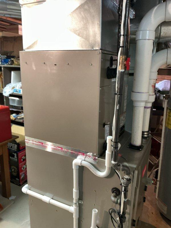 Completed installation of 4-ton Bryant air conditioning system with matching evaporator coil in rear configuration. Unit was properly connected to existing furnace system, all refrigerant lines installed and charged to manufacturer specifications, electrical connections completed per code requirements, and condensate drainage system verified operational. Mechanical permit was requested and obtained prior to installation, all safety labels and technical specifications affixed to equipment, and system tested for proper operation including voltage checks and airflow verification.