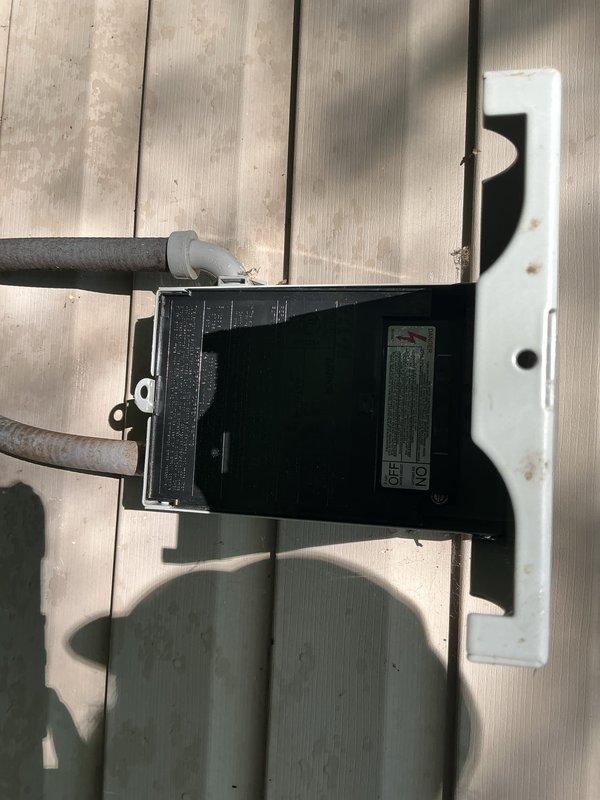 Performed leak search and tune-up on 4-year-old residential HVAC system with air handler located in basement. Replaced metering device gasket as requested. Inspected outdoor unit electrical disconnect box and refrigerant line connections, finding all components properly secured and in good working condition. Removed accumulated organic debris including leaves, twigs, and dirt from condensate drain pan. Inspected drain pan components and noted corrosion on some fasteners. Verified system operational status with all equipment functioning properly at time of service.